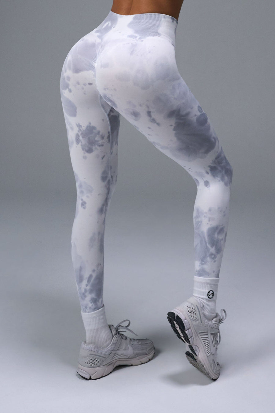 Back View of White TLF Cosmic Seamless Scrunch Butt Leggings, featuring a scrunch butt to shape and contour your glutes