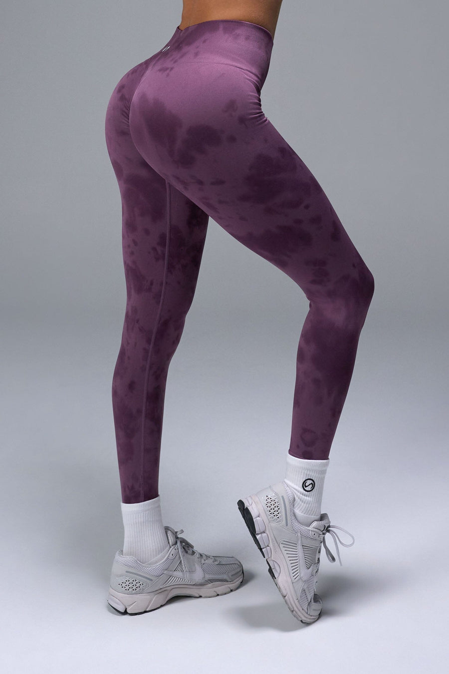 Side View of Purple TLF Cosmic Seamless Scrunch Butt Leggings, featuring a scrunch butt to shape and contour your glutes