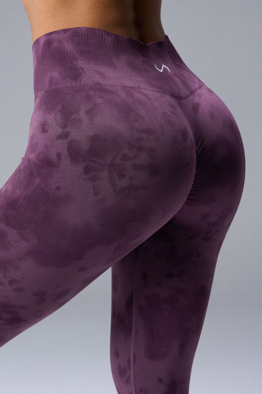 Back View of Purple TLF Cosmic Seamless Scrunch Butt Leggings, featuring a scrunch butt to shape and contour your glutes