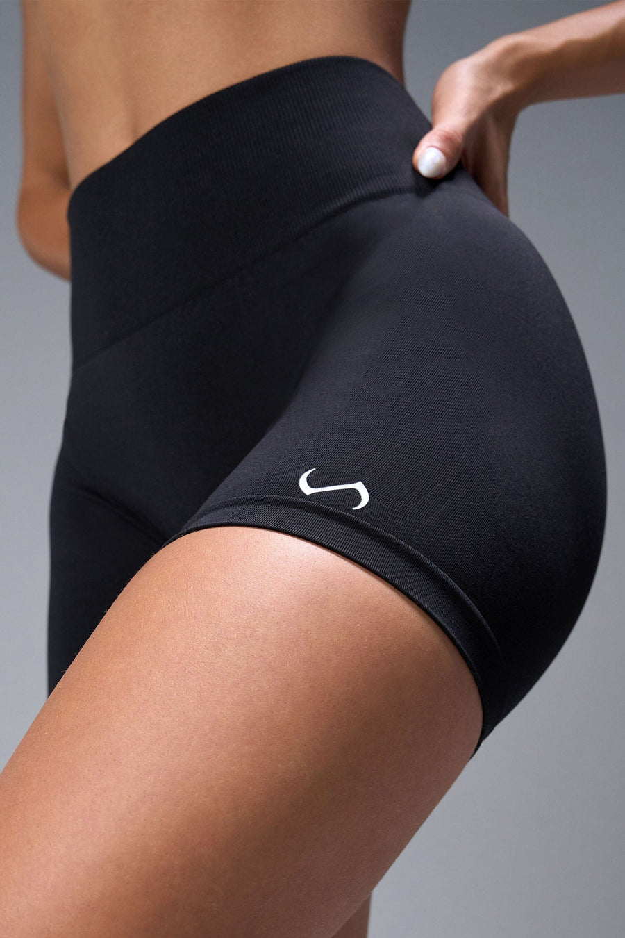 Front View of Black TLF Cosmic Seamless Scrunch Butt Shorts, featuring a scrunch butt to shape and contour your glutes