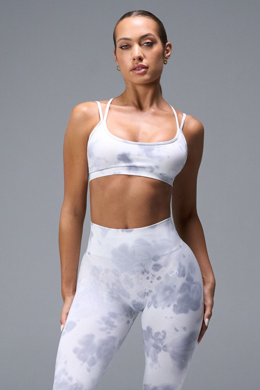 Front View of White TLF Cosmic Seamless Strappy Sports, featuring medium impact support and a strappy back design