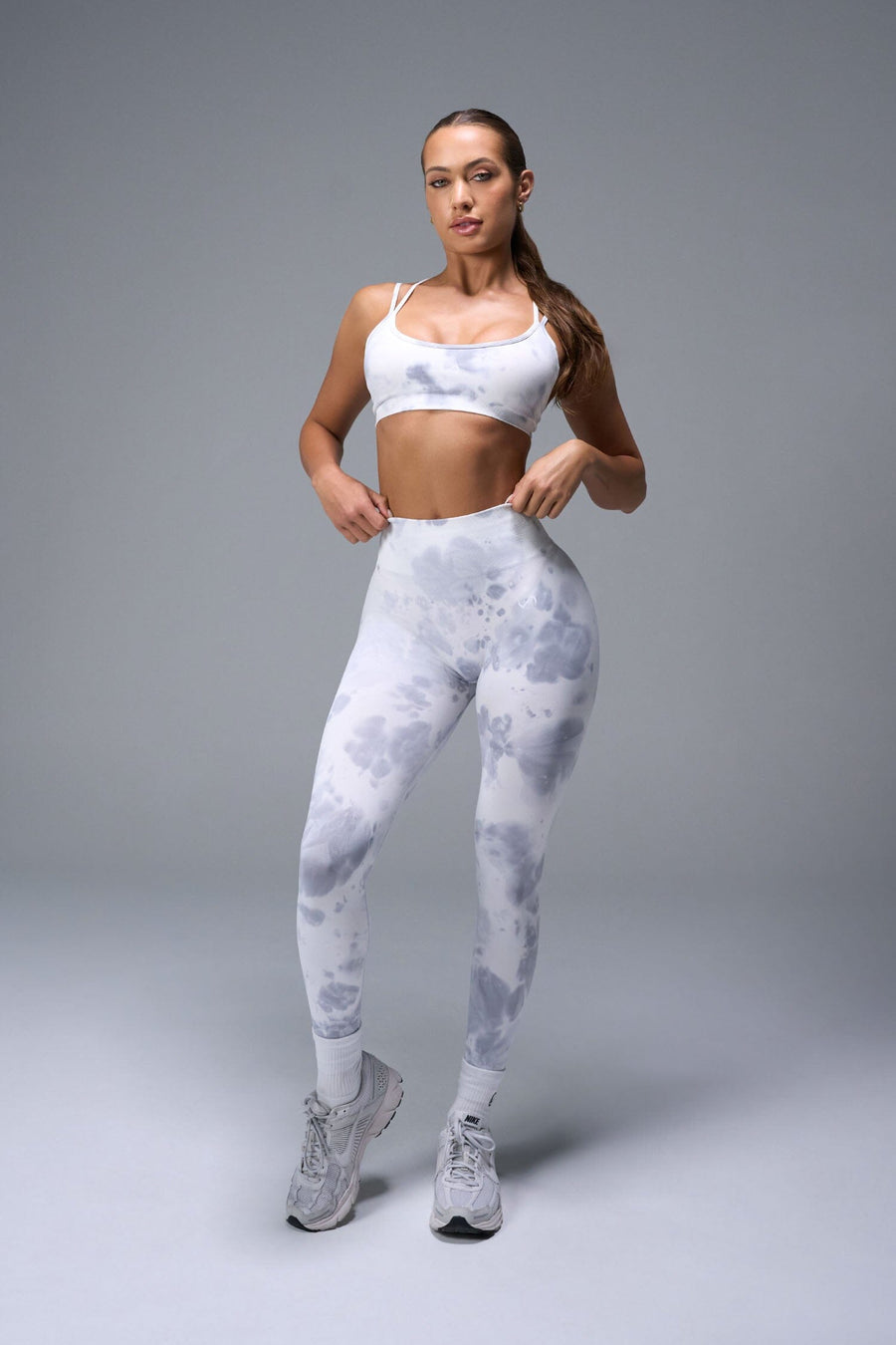 Front View of White TLF Cosmic Seamless Strappy Sports, featuring medium impact support and a strappy back design