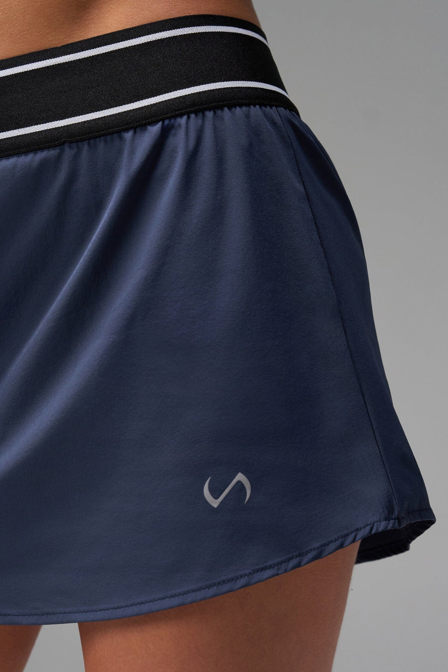 Front View of Blue TLF Element workout skirt featuring built in 2.5-inch inseam shorts and side pockets
