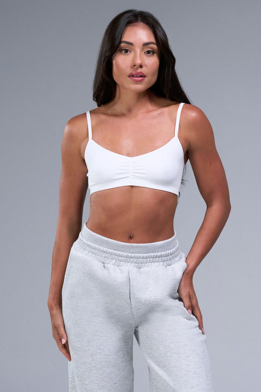 Front View of White TLF Essential Scrunch Seamless Bralette, featuring adjustable straps for a custom fit and scrunch front design