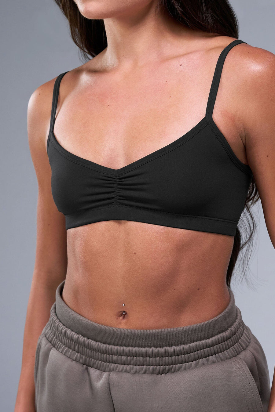 Front View of Black TLF Essential Scrunch Seamless Bralette, featuring adjustable straps for a custom fit and scrunch front design