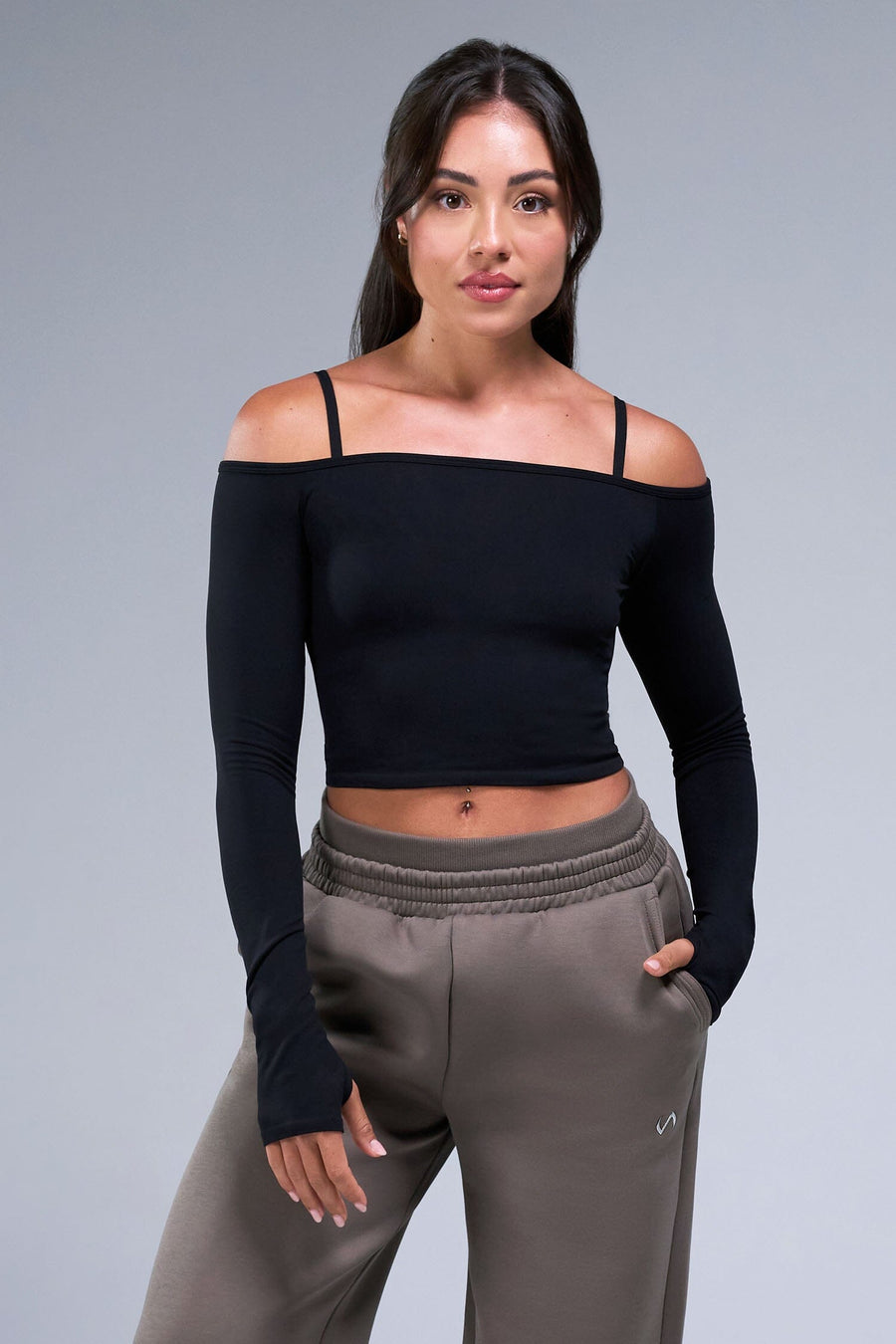 Front View of Black TLF Essential Seamless off the shoulder top, featuring a cropped length and thumbholes