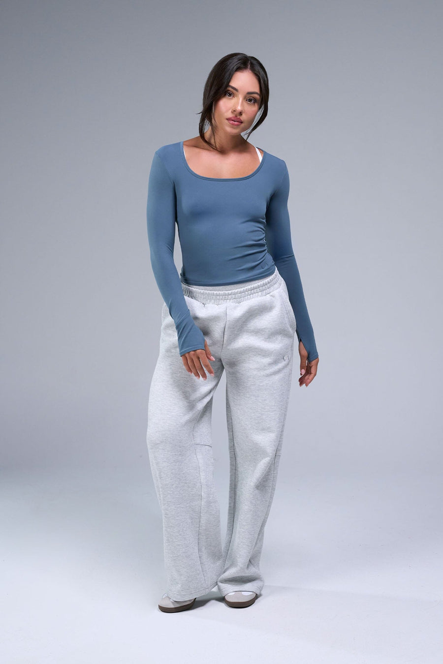 Front View of Blue TLF Essential Seamless Reversible Scoop Neck, featuring thumbholes and multi wear for boat neck or scoop neck styling