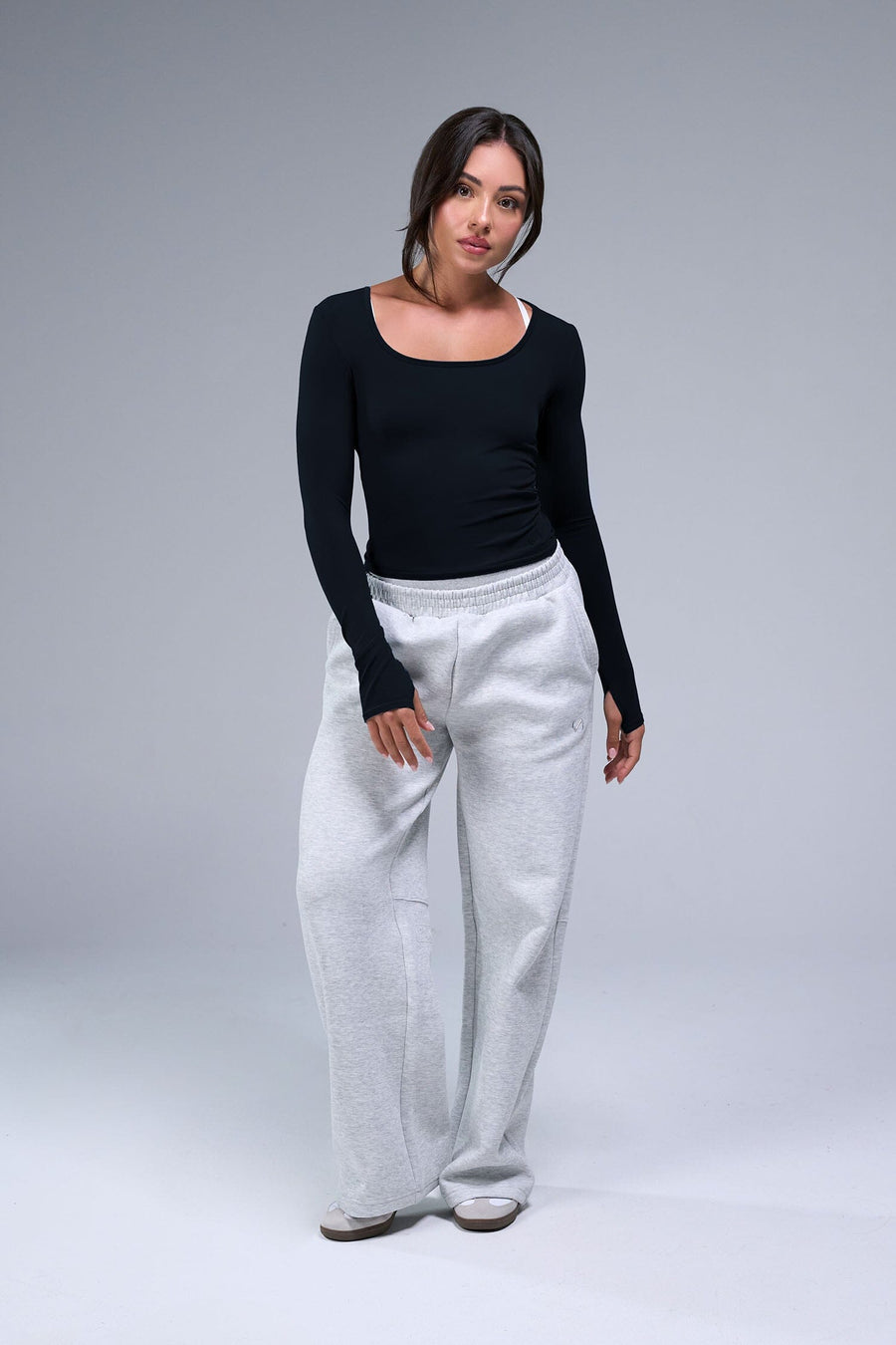 Front View of Black TLF Essential Seamless Reversible Scoop Neck, featuring thumbholes and multi wear for boat neck or scoop neck styling
