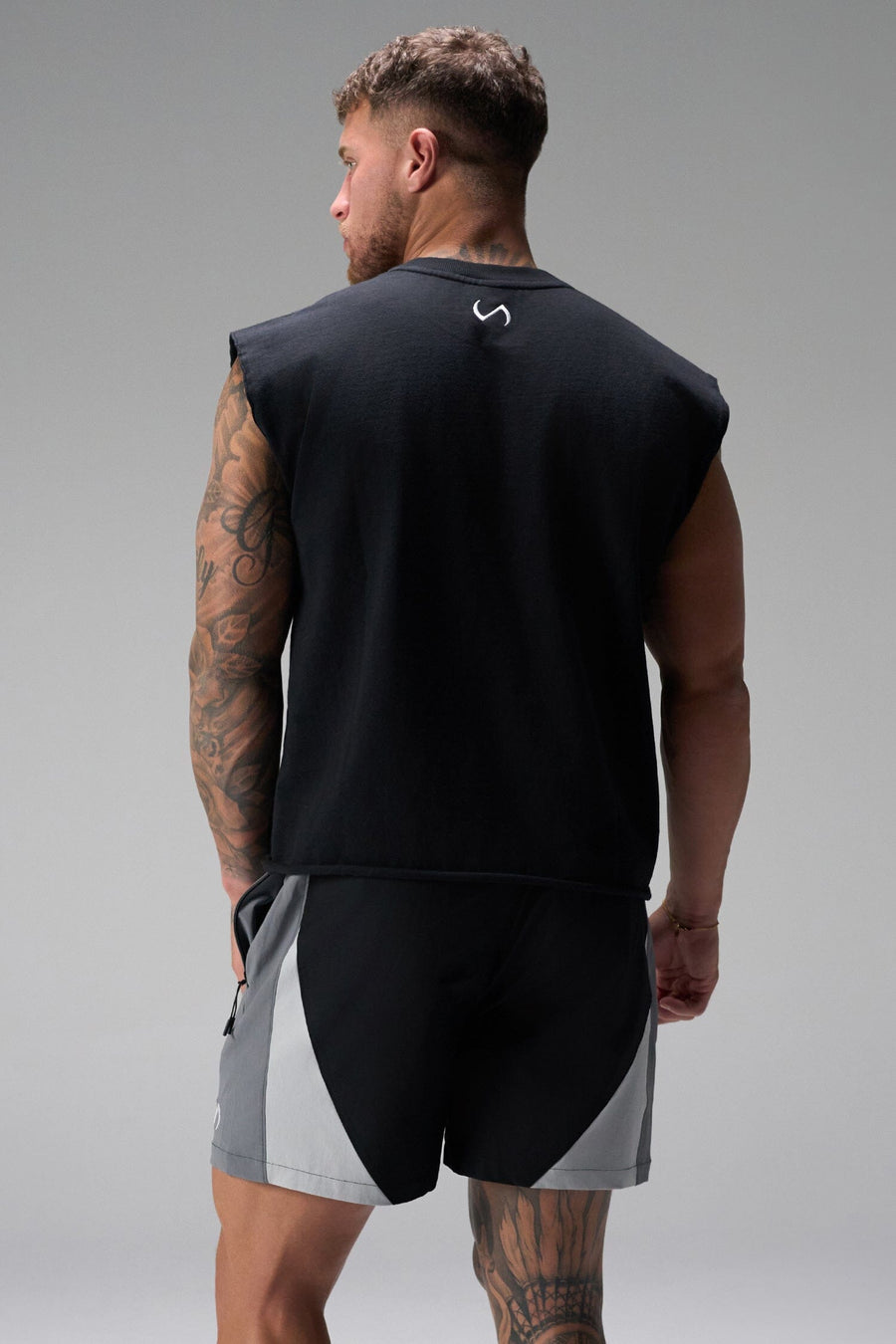 Back View of Black the TLF GTS Element-Max Shorts featuring contrast color panels and sleek invisible side zipper pockets