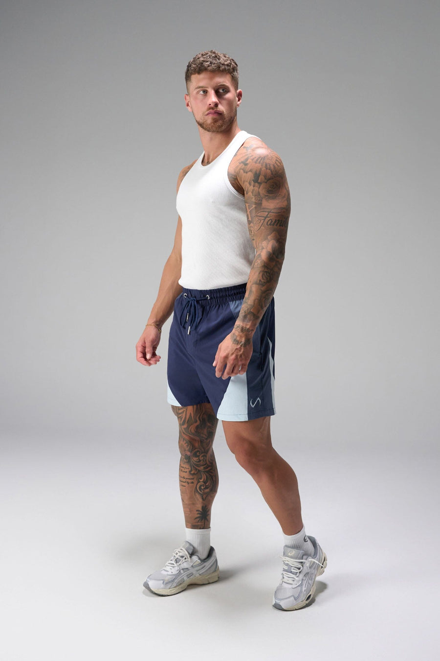Front View of Blue the TLF GTS Element-Max Shorts featuring contrast color panels and sleek invisible side zipper pockets
