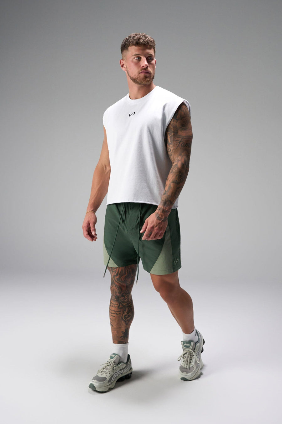 Front View of Green the TLF GTS Element-Max Shorts featuring contrast color panels and sleek invisible side zipper pockets