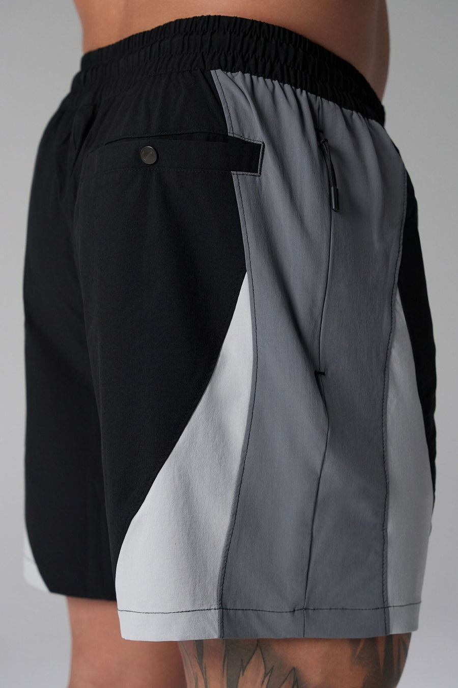 Side View of Black the TLF GTS Element-Max Shorts featuring contrast color panels and sleek invisible side zipper pockets