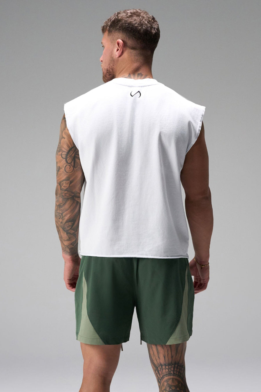 Back View of Green the TLF GTS Element-Max Shorts featuring contrast color panels and sleek invisible side zipper pockets