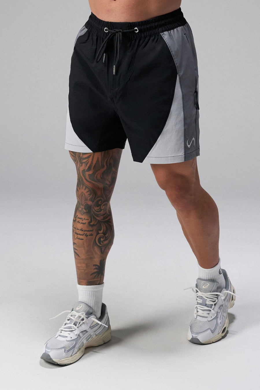 Front View of Black the TLF GTS Element-Max Shorts featuring contrast color panels and sleek invisible side zipper pockets