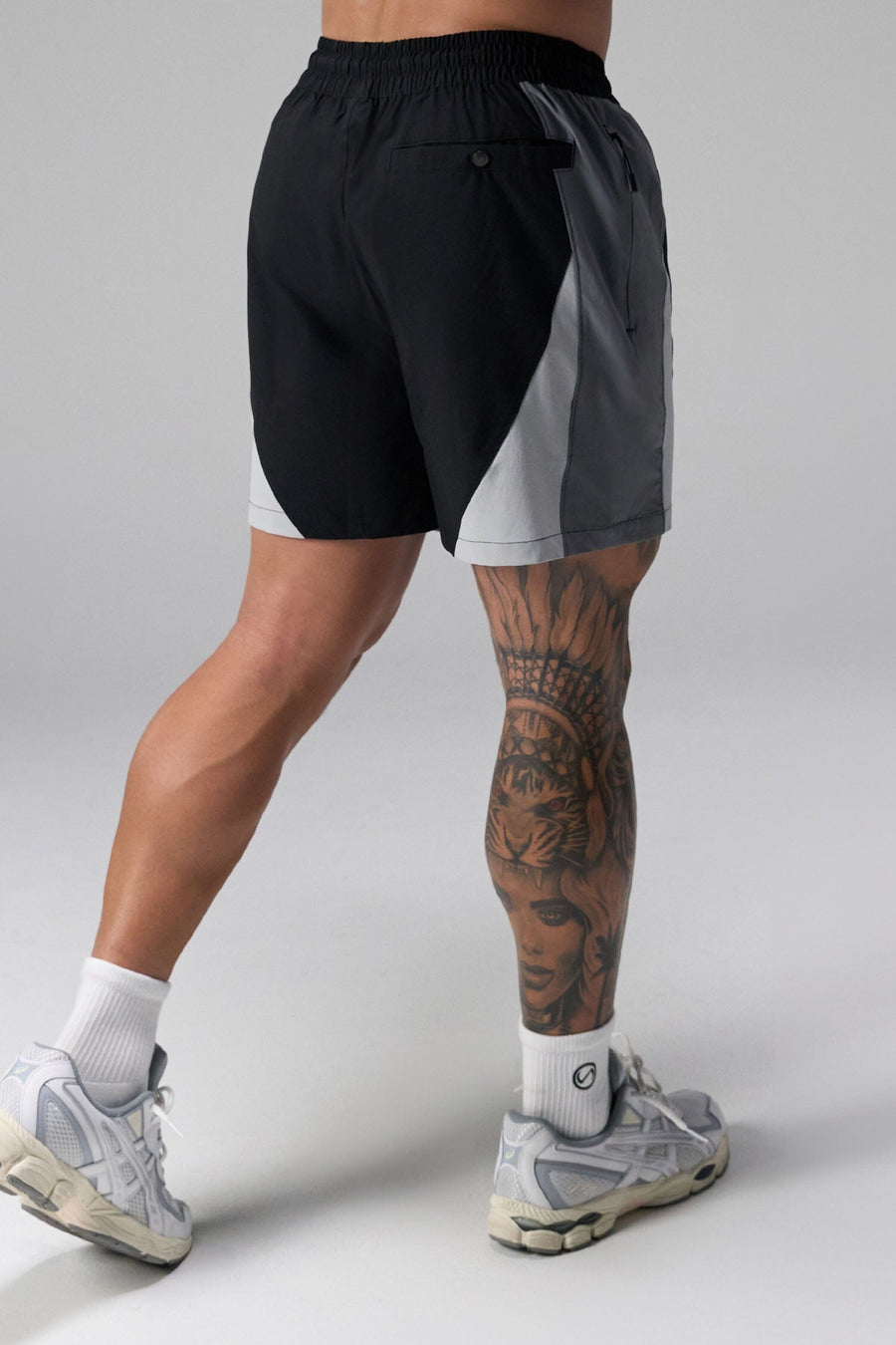 Back View of Black the TLF GTS Element-Max Shorts featuring contrast color panels and sleek invisible side zipper pockets