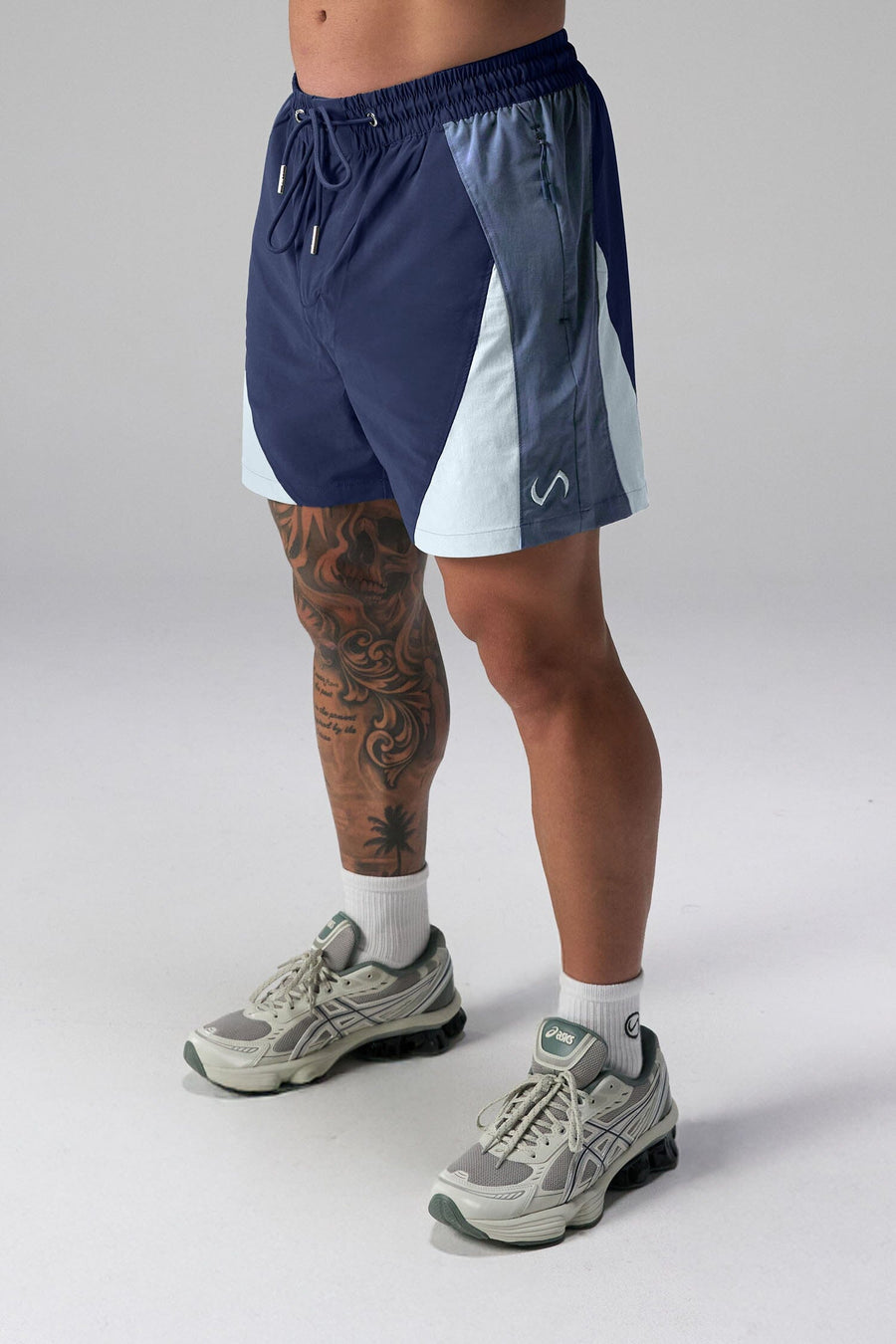 Front View of Blue the TLF GTS Element-Max Shorts featuring contrast color panels and sleek invisible side zipper pockets