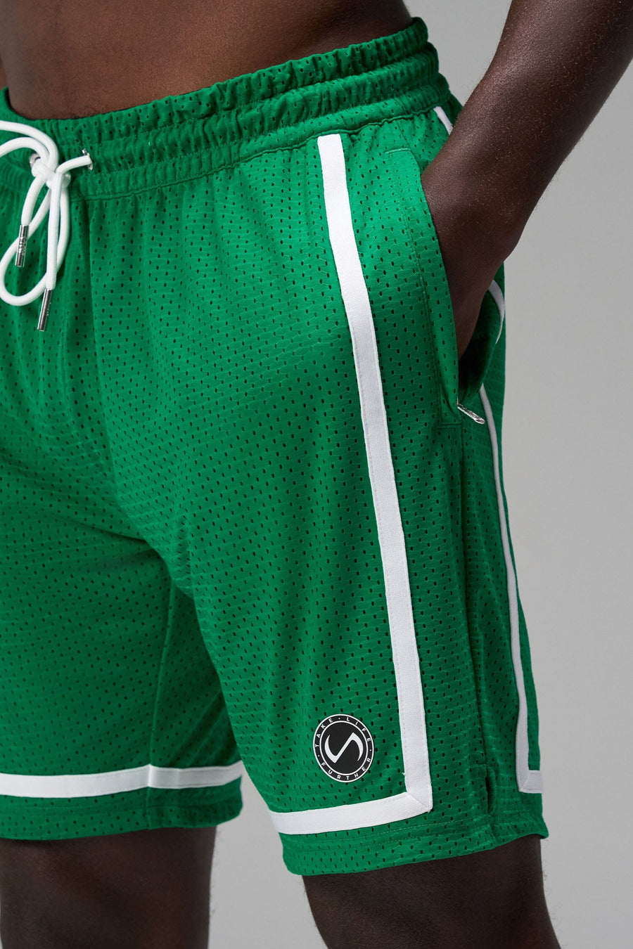 Front View of Green GTS Athletic 8 Inch Shorts, featuring an 8-inch inseam and zipper pockets