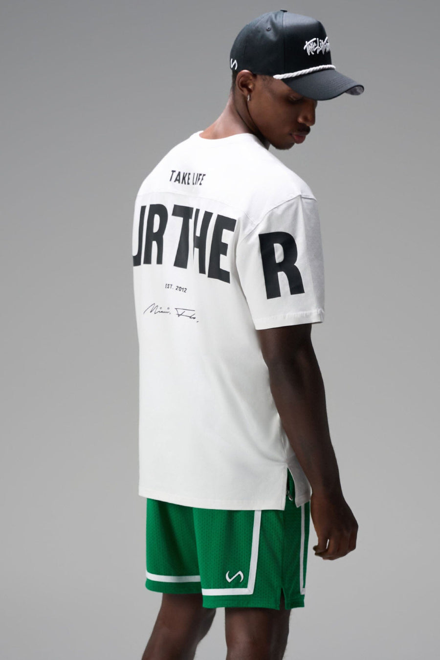 Back View of Green GTS Athletic 8 Inch Shorts, featuring an 8-inch inseam and zipper pockets