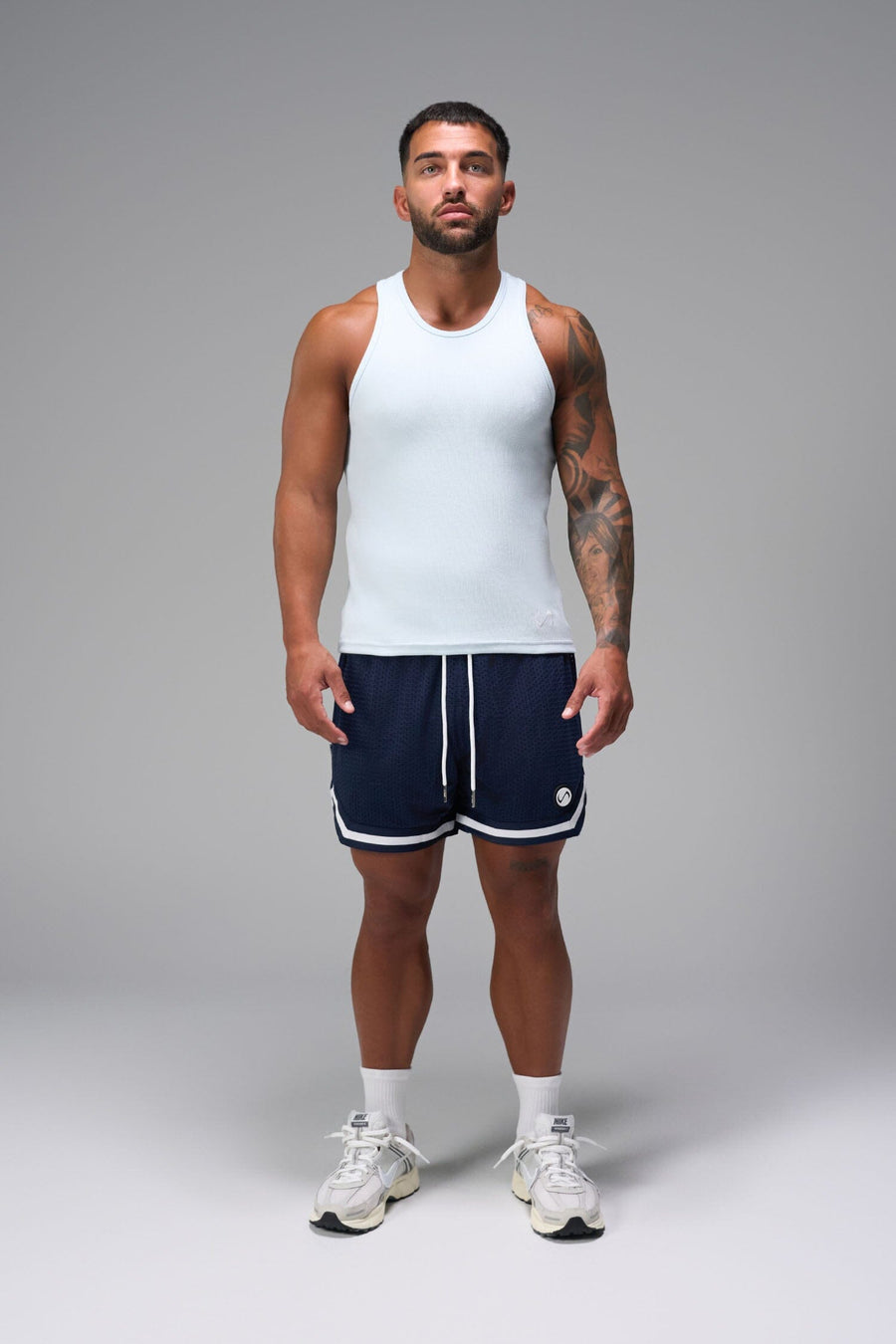 Front View of Blue GTS Evolve Mesh 6 Inch Shorts, featuring dual side pockets and 6 inch inseam for performance and functionality