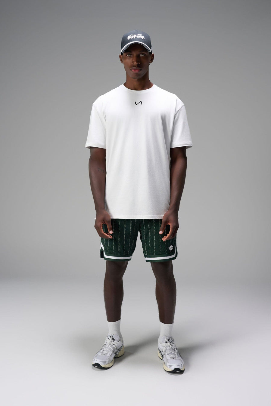 Front View of Green GTS Evolve Mesh 8 Inch Shorts, featuring an 8-inch inseam, custom pinstripe design and zipper pockets