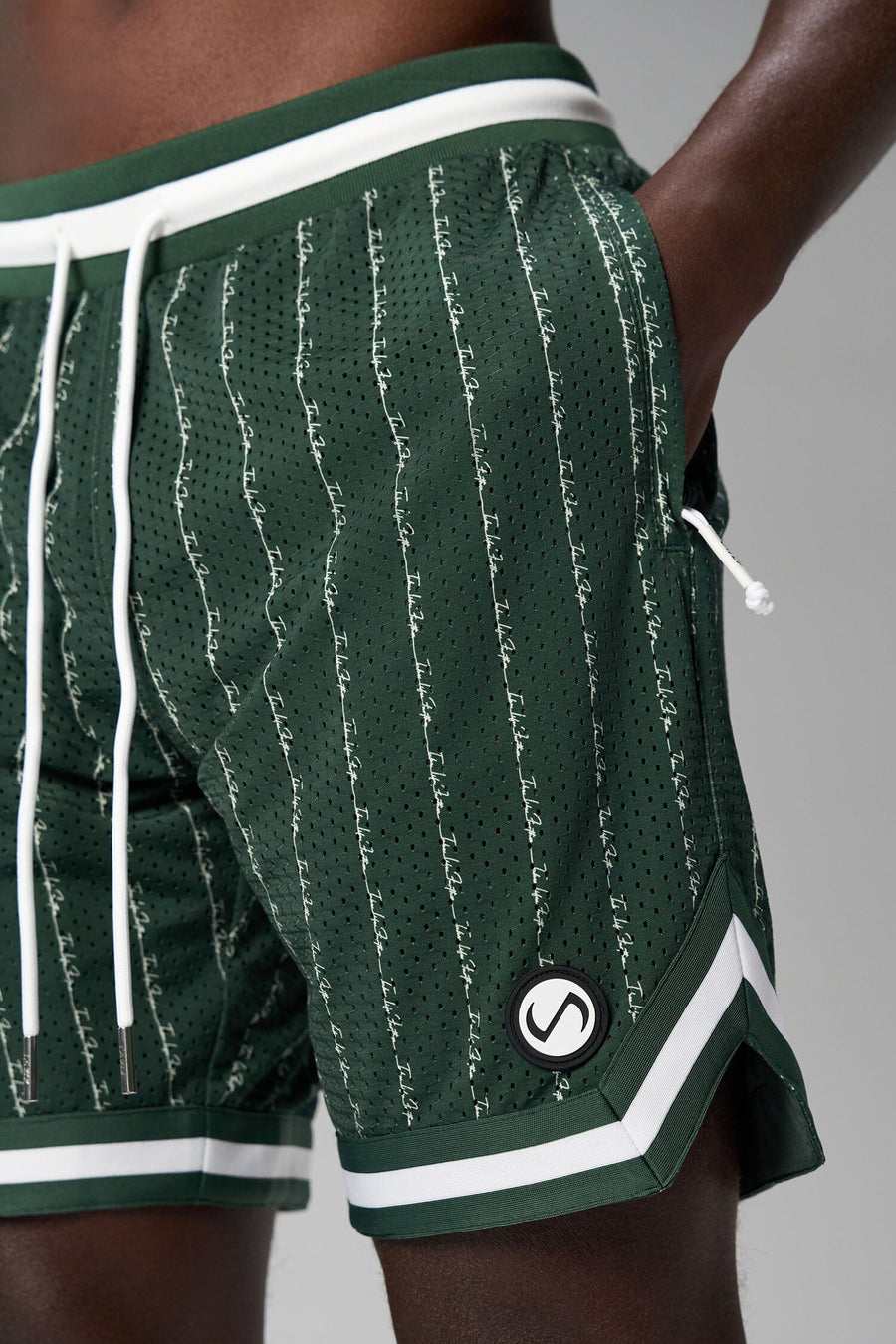 Front View of Green GTS Evolve Mesh 8 Inch Shorts, featuring an 8-inch inseam, custom pinstripe design and zipper pockets