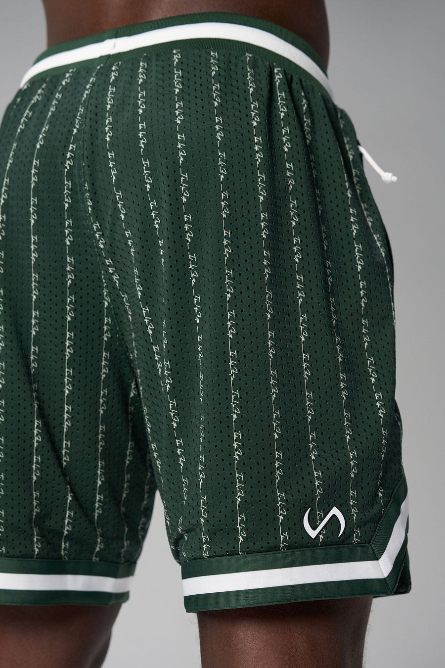Back View of Green GTS Evolve Mesh 8 Inch Shorts, featuring an 8-inch inseam, custom pinstripe design and zipper pockets