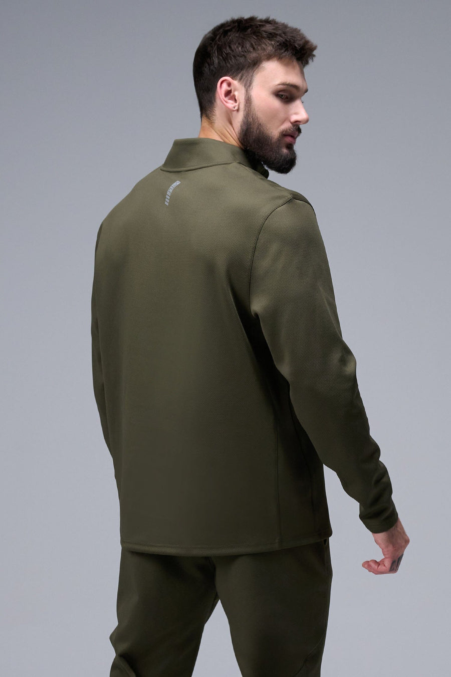 Back View of Marshland TLF GTS Quad Tech Quarter-Zip Pullover redefining modern activewear, this men’s 1/4 zip pullover blends technology with sleek style