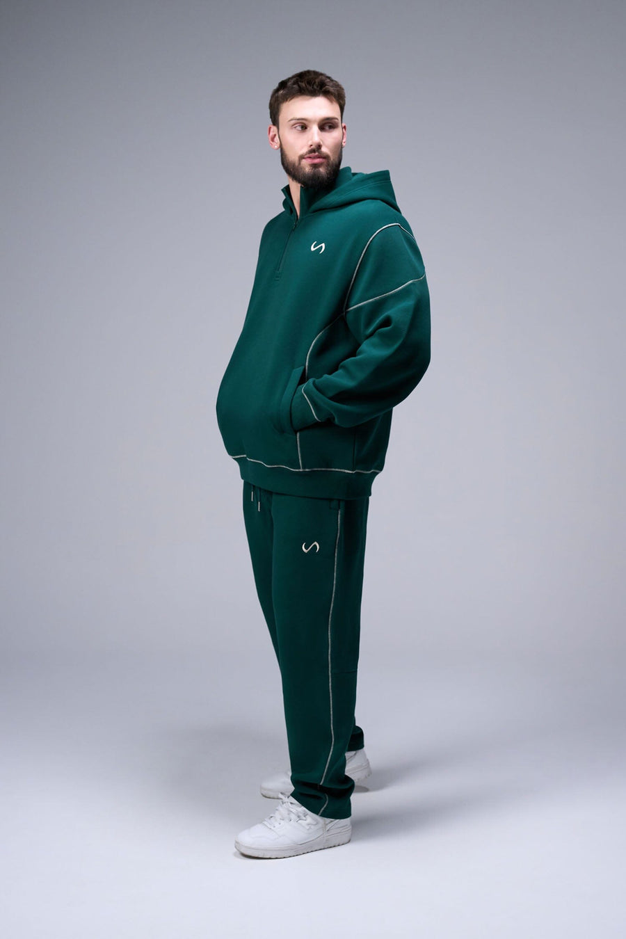 Front View of Dark Harvest Green TLF GTS Twill Tech Quarter-Zip Hoodie, featuring contrast stitching, kangaroo pockets and unmatched style