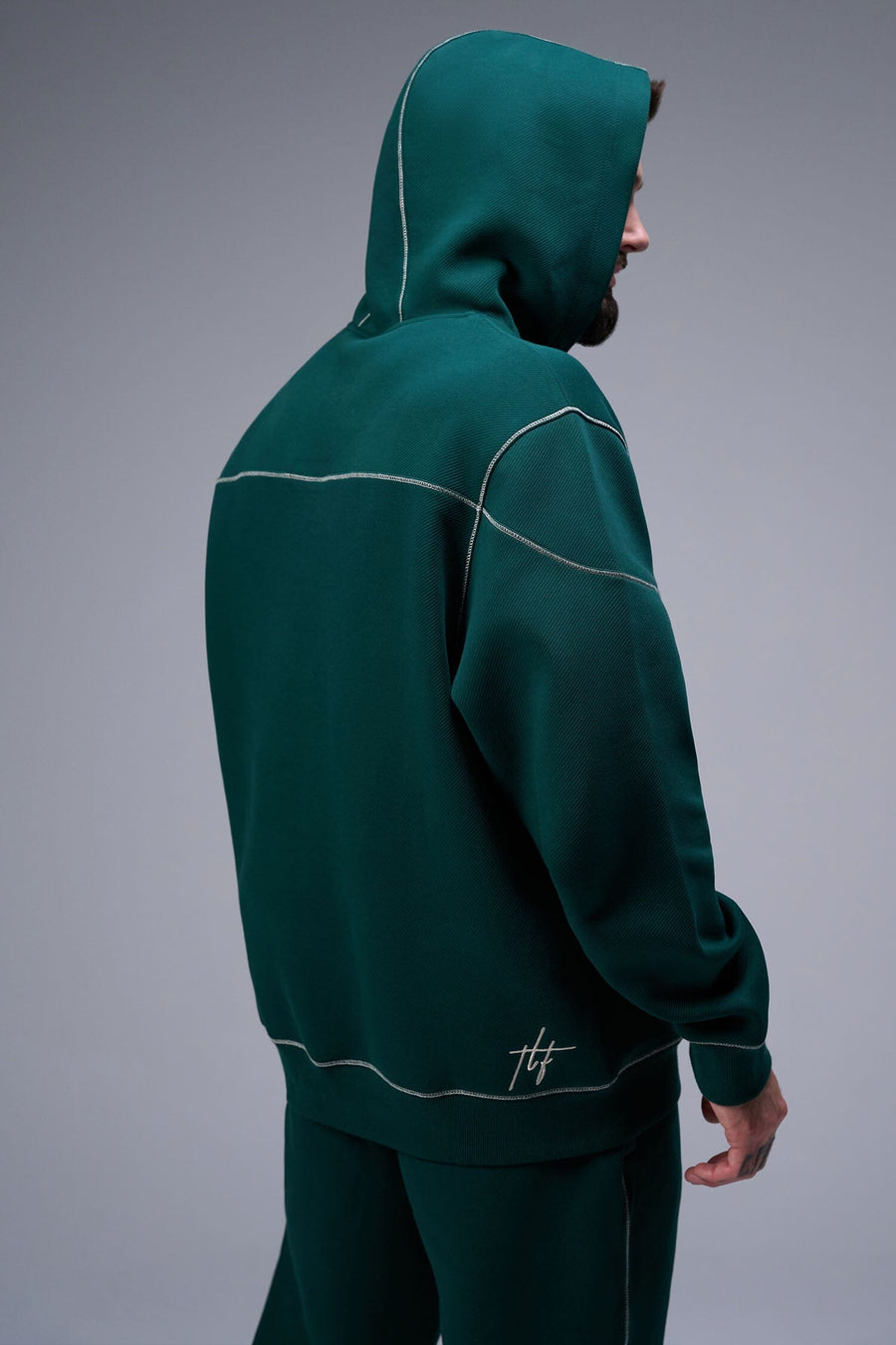 Back View of Dark Harvest Green TLF GTS Twill Tech Quarter-Zip Hoodie, featuring contrast stitching, kangaroo pockets and unmatched style