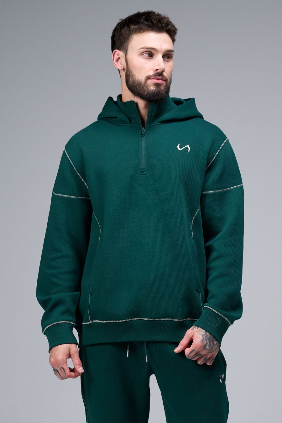 Front View of Dark Harvest Green TLF GTS Twill Tech Quarter-Zip Hoodie, featuring contrast stitching, kangaroo pockets and unmatched style