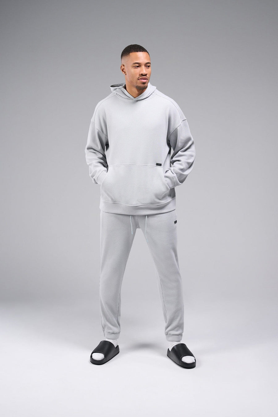Front View of Gray TLF GTS Waffle Tech Hoodie, featuring kangaroo pockets, and double panel hoodie designed for all day wear