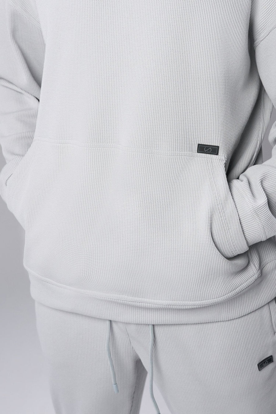 Front View of Gray TLF GTS Waffle Tech Hoodie, featuring kangaroo pockets, and double panel hoodie designed for all day wear