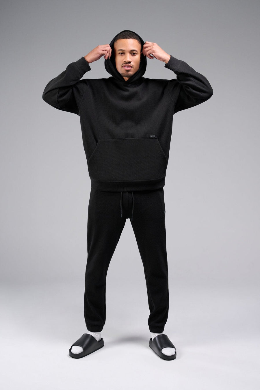 Front View of Black TLF GTS Waffle Tech Hoodie, featuring kangaroo pockets, and double panel hoodie designed for all day wear