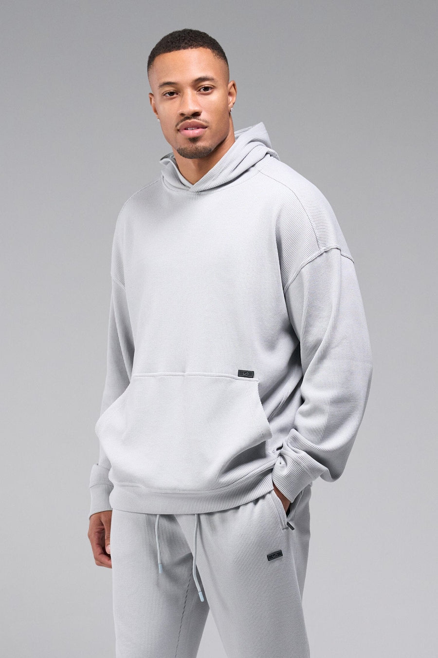 Front View of Gray TLF GTS Waffle Tech Hoodie, featuring kangaroo pockets, and double panel hoodie designed for all day wear