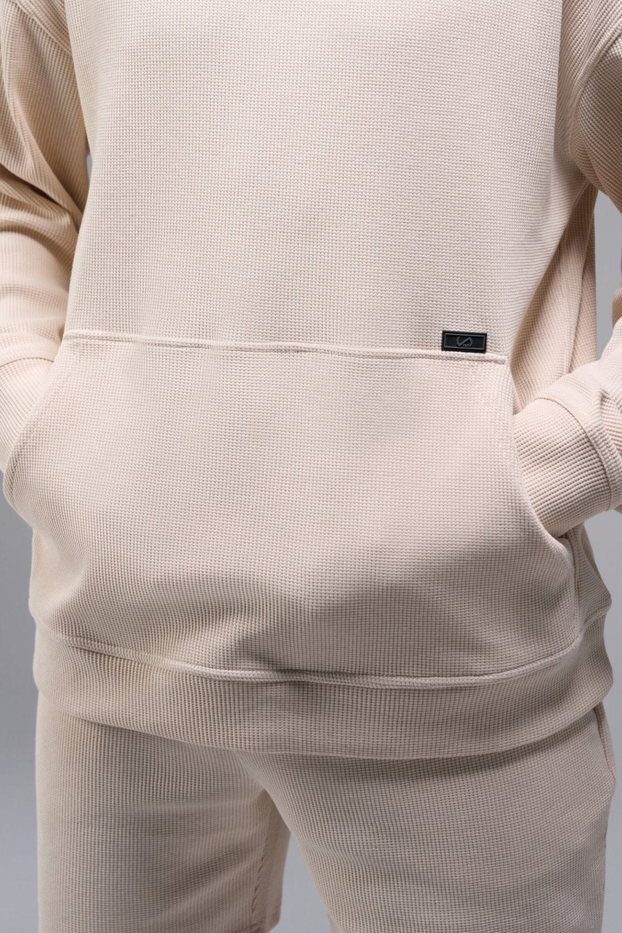 Front View of White TLF GTS Waffle Tech Hoodie, featuring kangaroo pockets, and double panel hoodie designed for all day wear