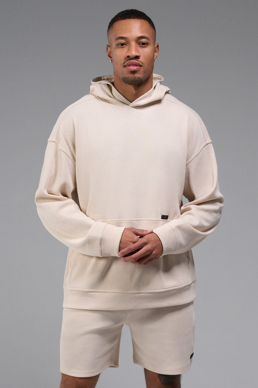 Front View of White TLF GTS Waffle Tech Hoodie, featuring kangaroo pockets, and double panel hoodie designed for all day wear