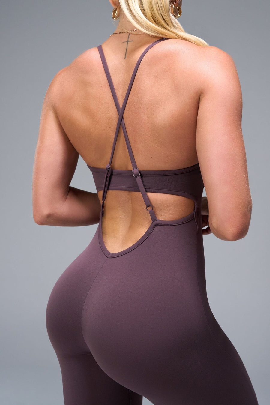 Back View of Brown TLF NeoCloud™ Flare Jumpsuit featuring a built-in low support sports bra with removable pads and adjustable straps