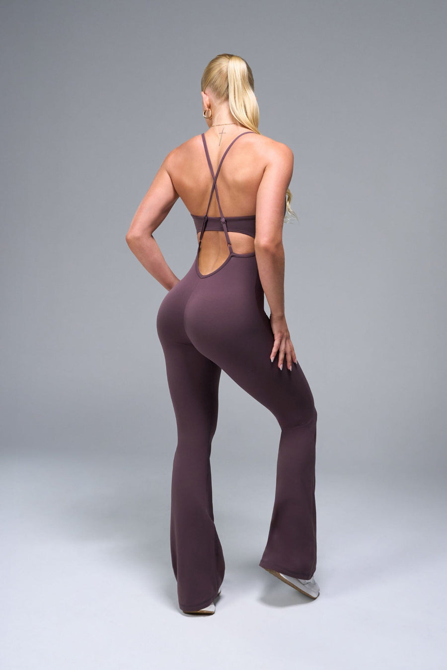 Back View of Brown TLF NeoCloud™ Flare Jumpsuit featuring a built-in low support sports bra with removable pads and adjustable straps