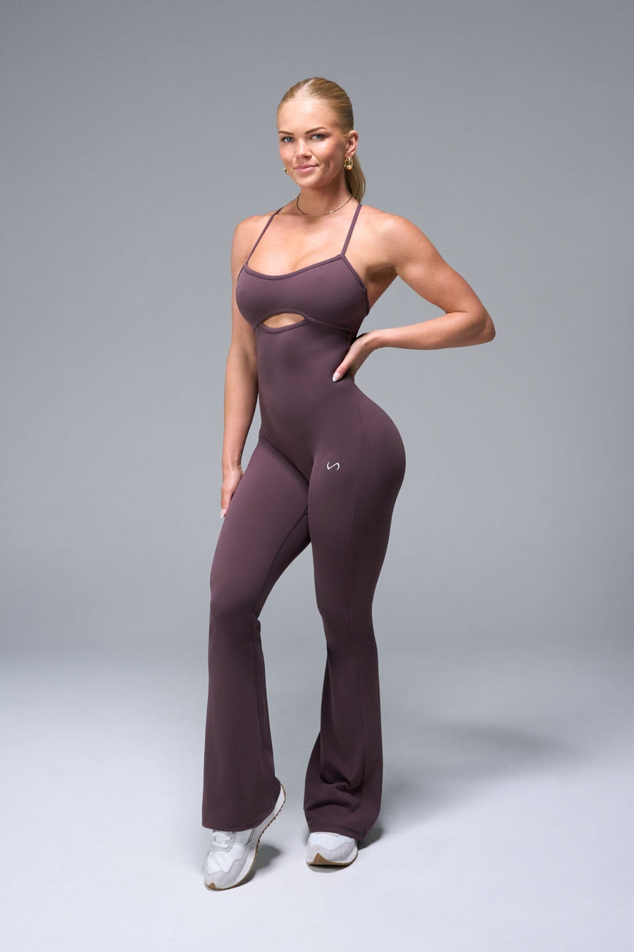 Front View of Brown TLF NeoCloud™ Flare Jumpsuit featuring a built-in low support sports bra with removable pads and adjustable straps