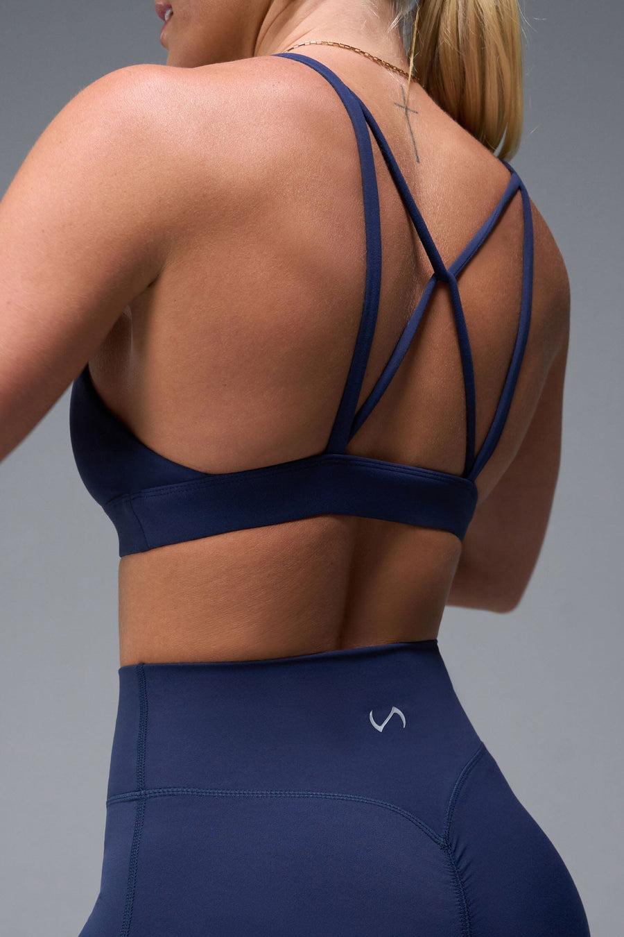 Back View of Blue TLF NeoCloud™ Keyhole Sports Bra featuring a strappy back and keyhole front design with low to medium support