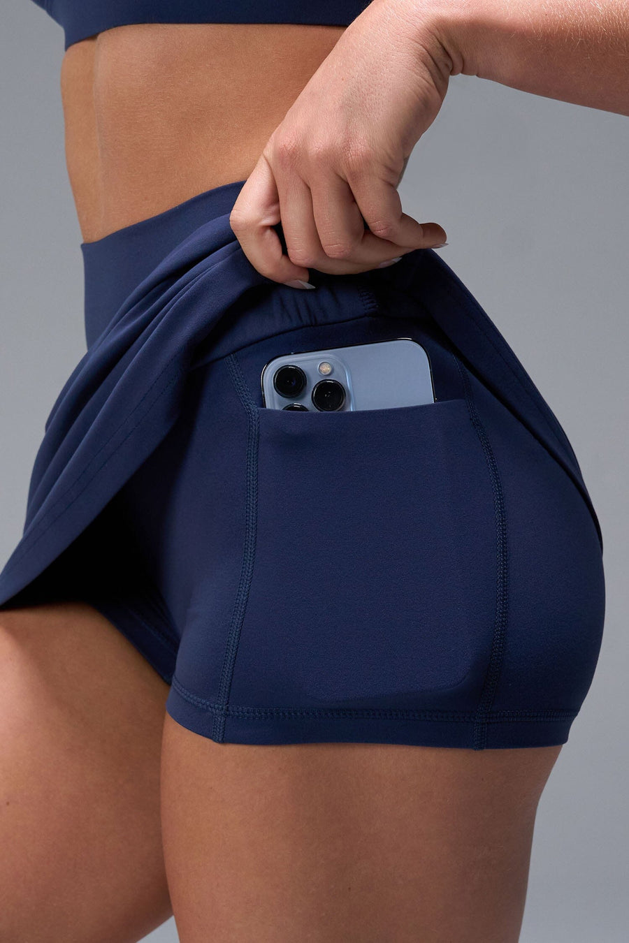 Front View of Blue TLF NeoCloud™ workout skirt featuring built in 2.5-inch inseam shorts and side pockets