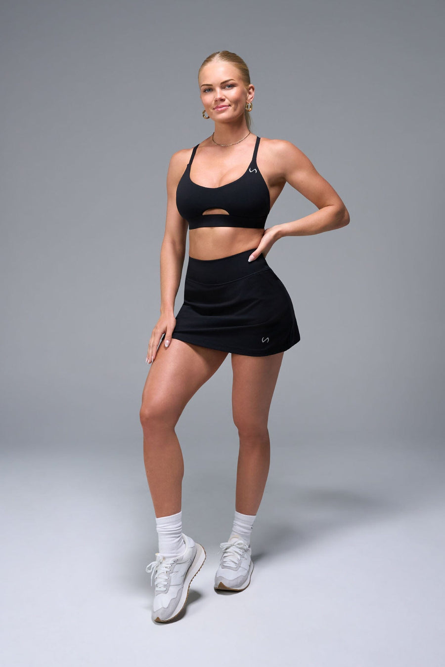 Front View of Black TLF NeoCloud™ workout skirt featuring built in 2.5-inch inseam shorts and side pockets