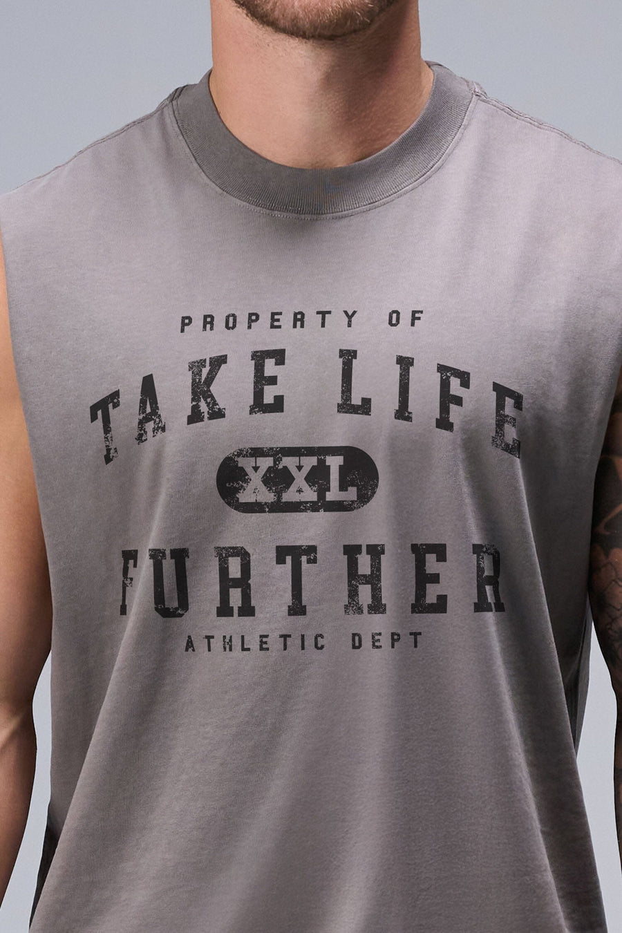 Detail View of Gray TLF Property Of Heavy Cotton Muscle Tank featuring a distressed graphic design and raw edge arm holes.