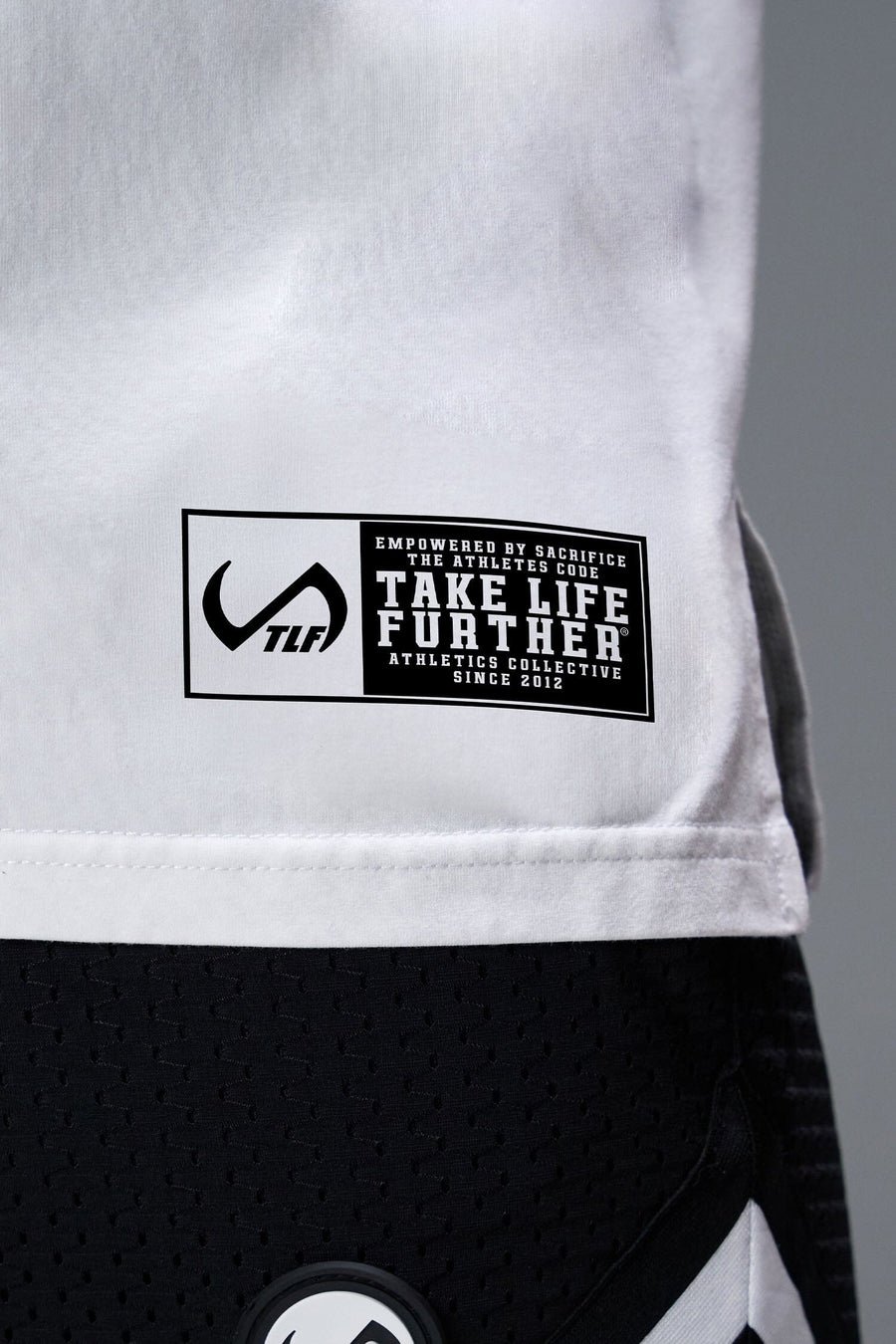 Detail Front View of White TLF Property of Cotton Luxe Oversized Tee featuring a distressed graphic print design across the chest in our oversized t shirt fit