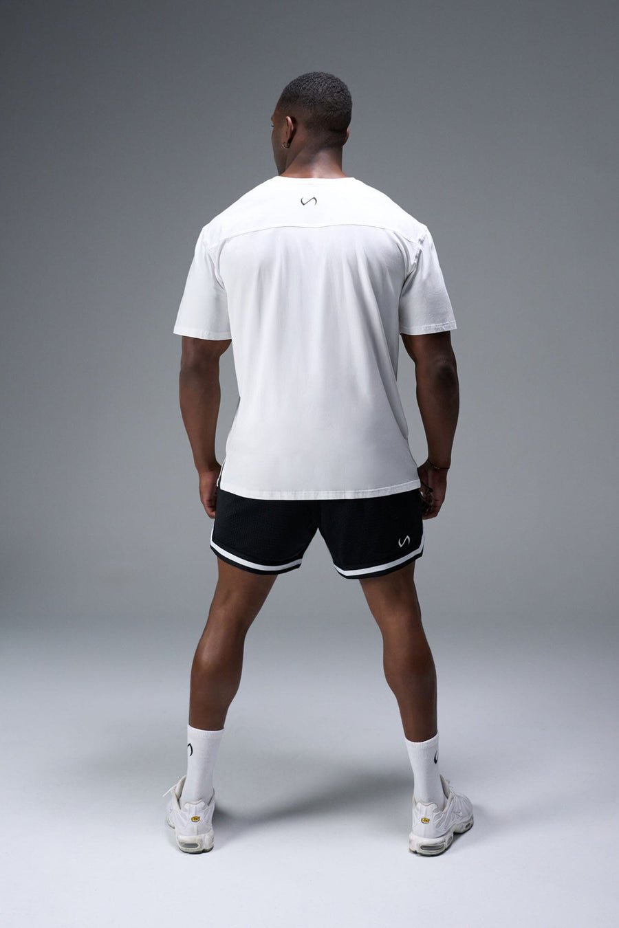 Back View of White TLF Property of Cotton Luxe Oversized Tee featuring a distressed graphic print design across the chest in our oversized t shirt fit