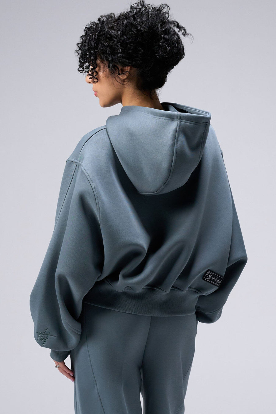 Back View Of Women's Scuba Tech Oversized Cropped Hoodie in Stormy Weather