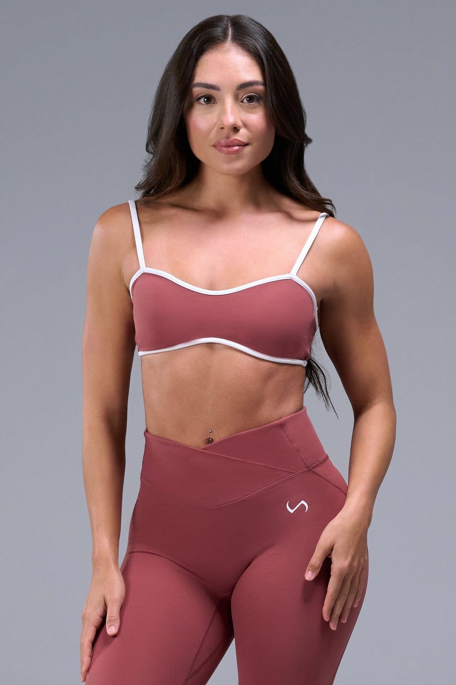 Front View of Orange Tempo Minimal Bralette 2.0, featuring removable pads and adjustable straps for low impact all day wear