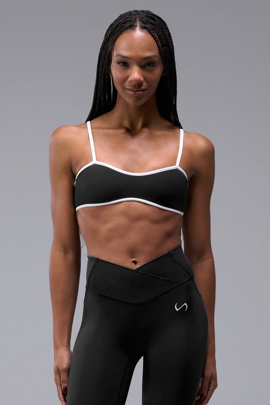 Front View of Black Tempo Minimal Bralette 2.0, featuring removable pads and adjustable straps for low impact all day wear