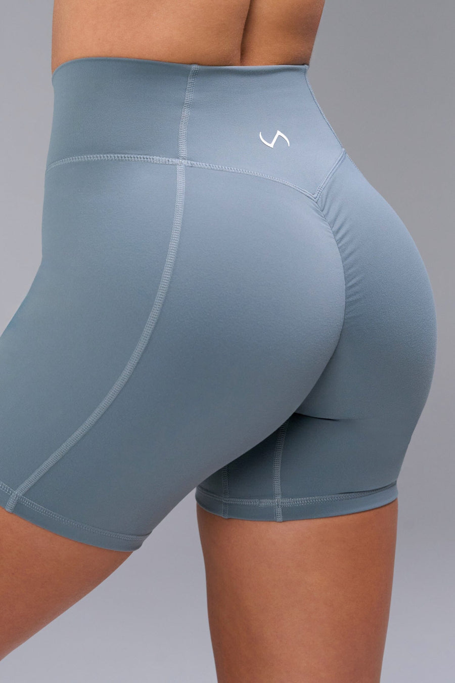 Back View of Blue TLF Tempo Scrunch Butt Shorts, featuring a butt scrunch that shapes your glutes with a snatched waist seam design