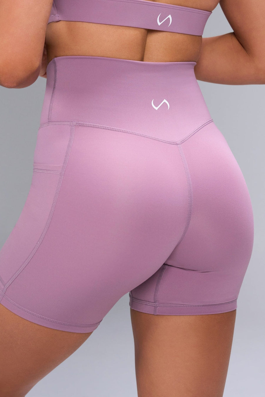 Back View of Purple TLF Tempo Side Pocket Shorts, featuring dual side pockets and a 5’5’ Inch Inseam for performance and functionality